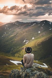 Lady Sitting Near Lake on Montain